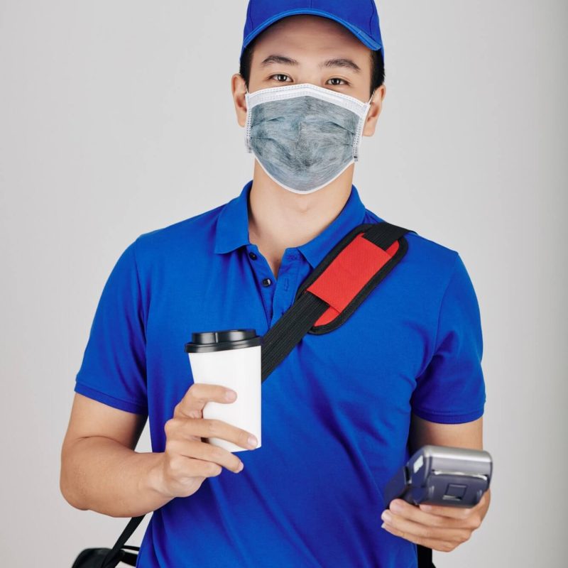 cheerful courier with cup of coffee 1.jpg