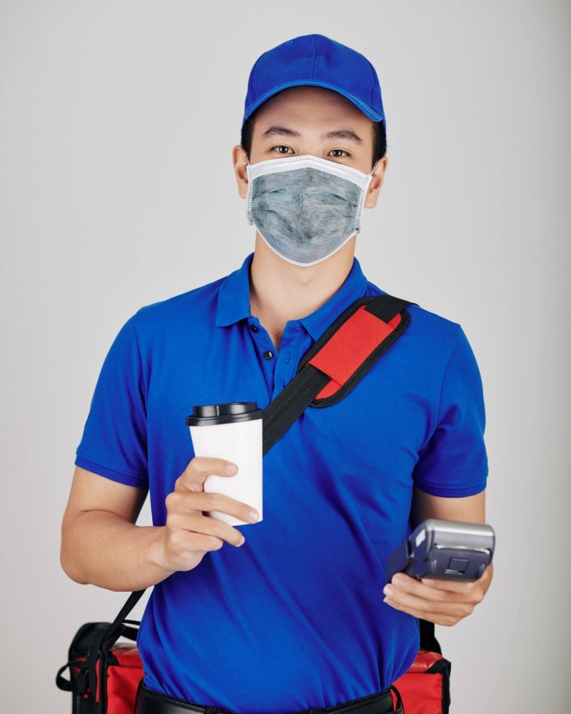 cheerful courier with cup of coffee 1.jpg